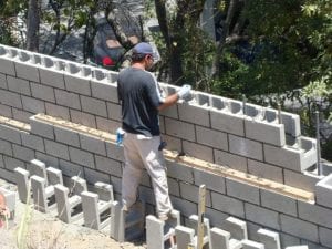 cinder-block-fence-install-768x576 1
