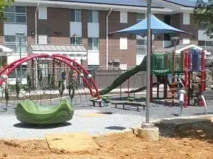 A playground in front of a Trex Seclusions Fence at the Parkway Overlook Apartments complex in Washington DC