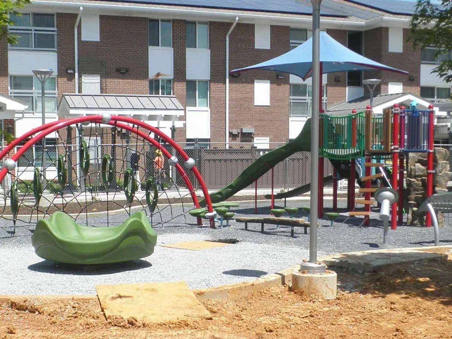 A playground in front of a Trex Seclusions Fence at the Parkway Overlook Apartments complex in Washington DC