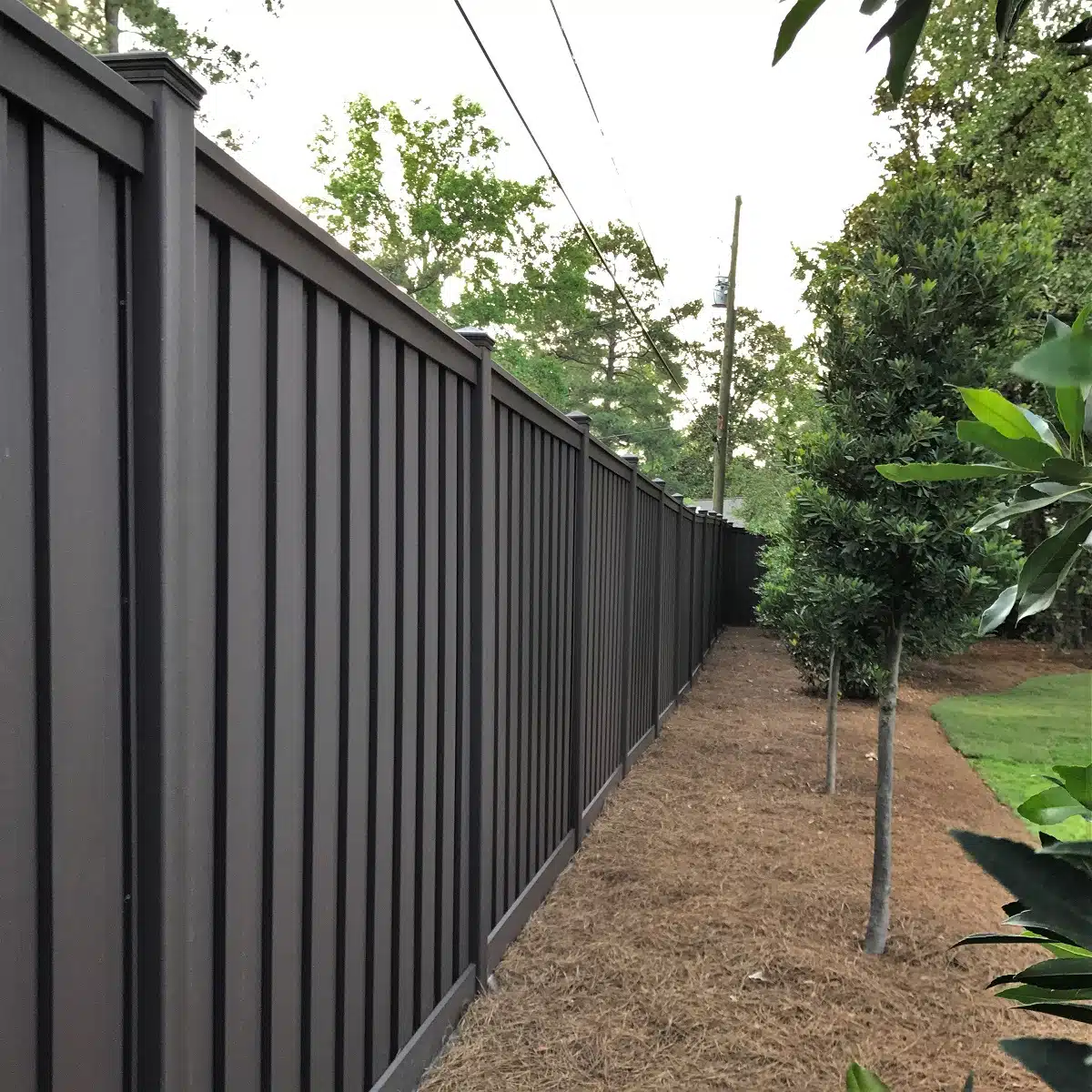 An 8 ft. tall Trex privacy Fence in a South Carolina residence's backyard.