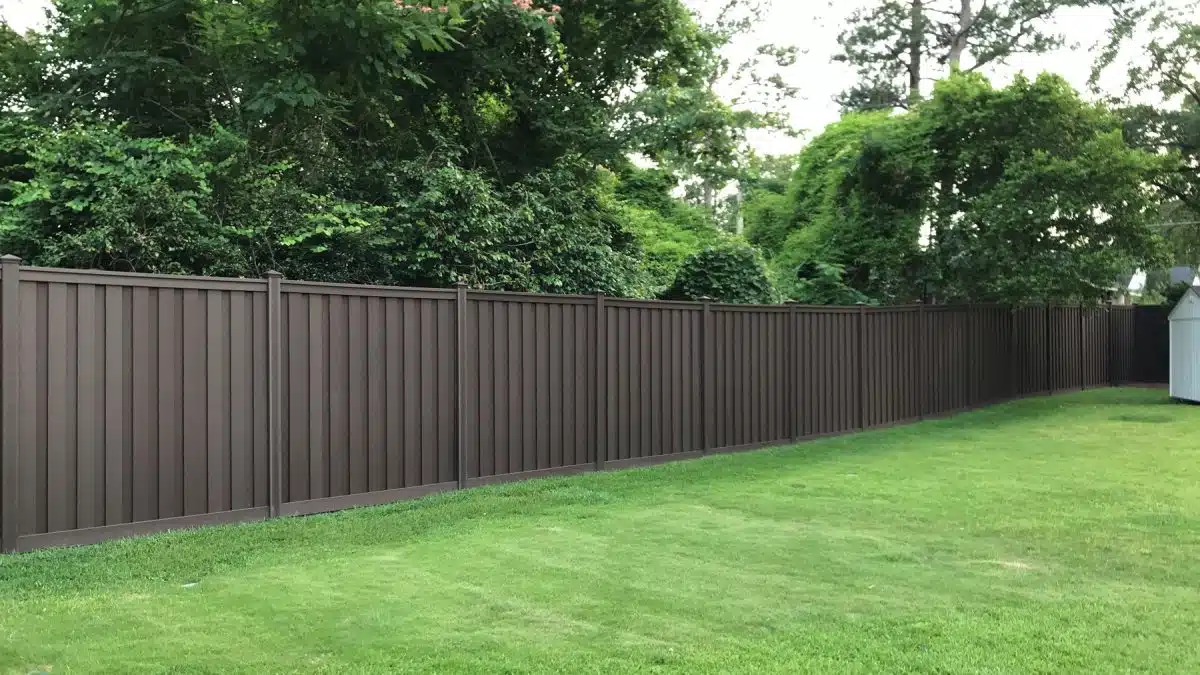 A Trex Seclusions Woodland Brown Privacy Fence in a South Carolina residence's backyard.