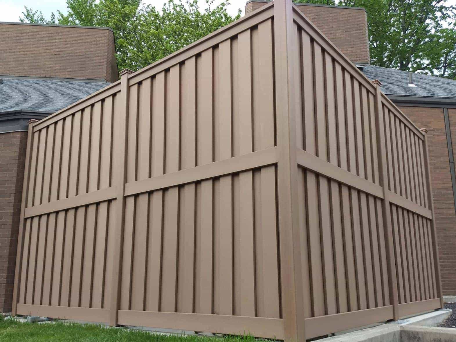 A 10 foot tall Trex privacy fence for a university housing HVAC enclosure