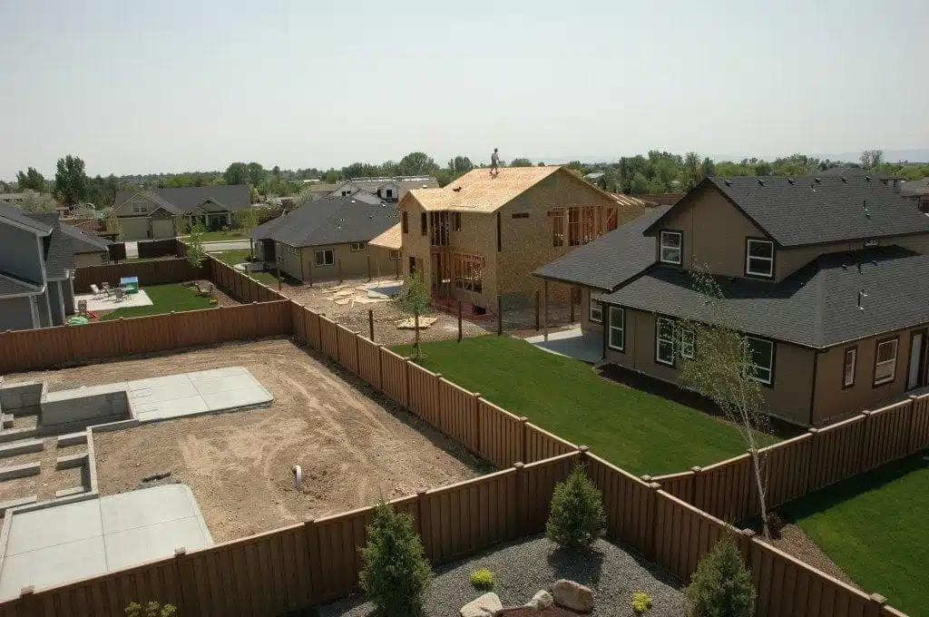 A picture from a high vantage point of a neighborhood with several backyards fenced in with Trex Seclusions.