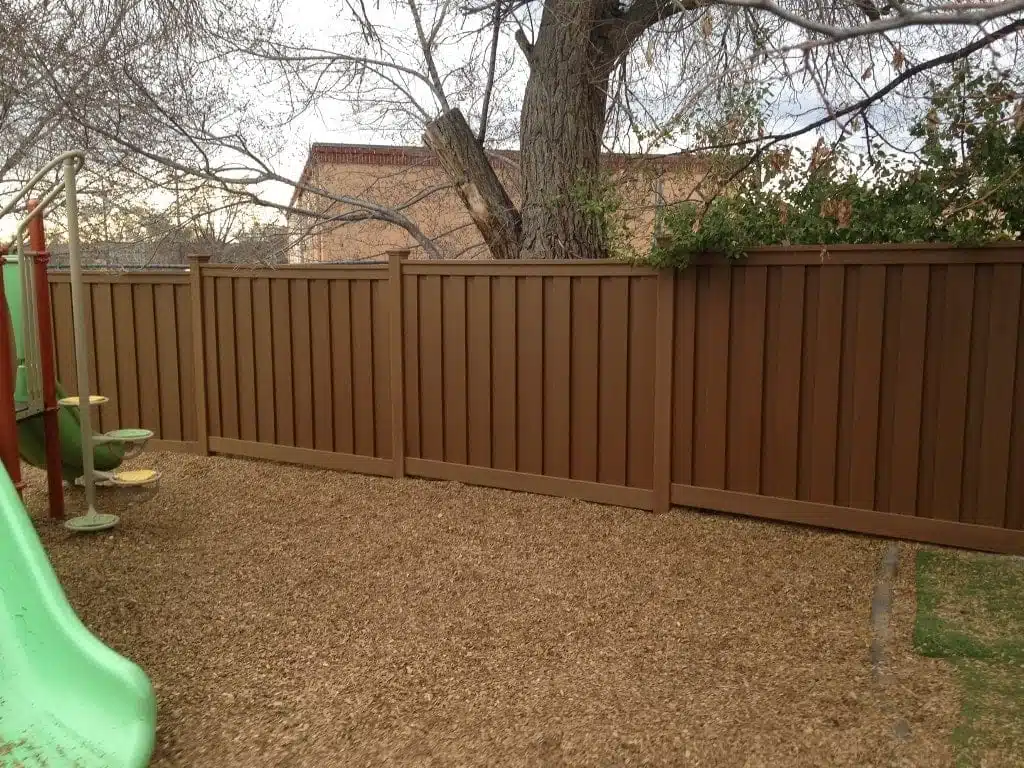 Several sections of Trex Fence protecting a children's play area in Santa Fe, NM.