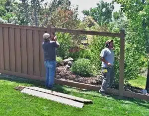 A fence contractor crew building a Trex Fencing