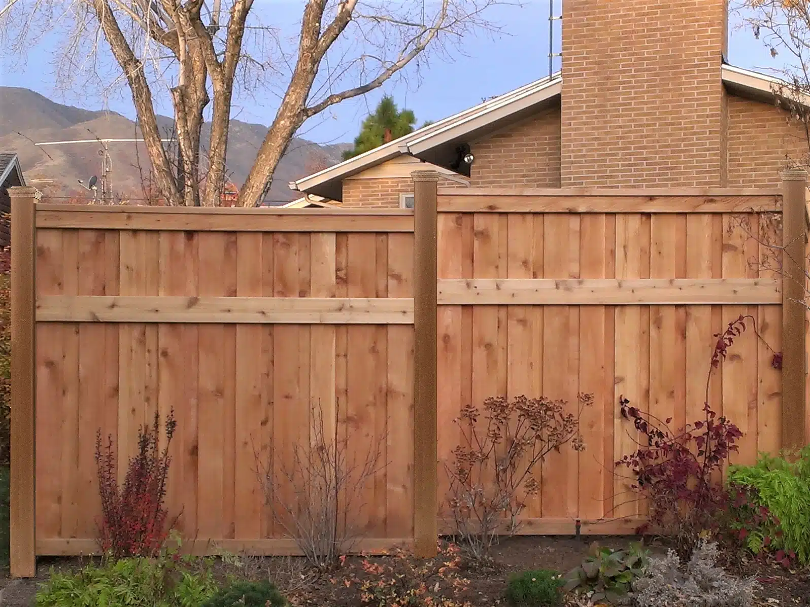 A Wood Fence using Trex composite posts.